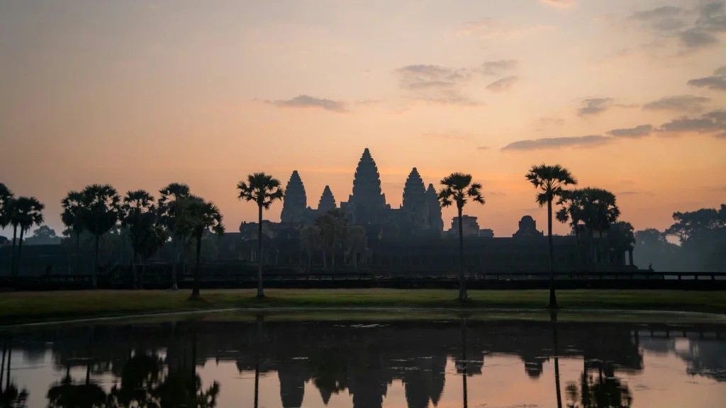 Angkor Wat temple reflected in water at sunrise in Siem Reap, Cambodia